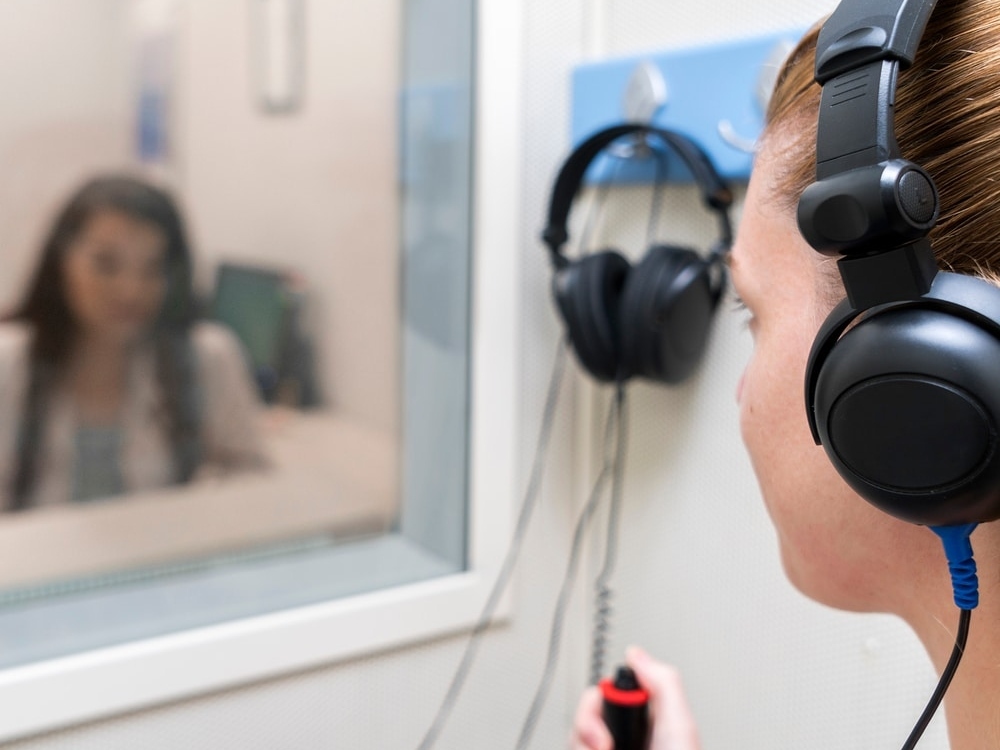 Hearing specialist conducting a free hearing evaluation with a patient at Contra Costa Hearing Aid Center in Walnut Creek, CA